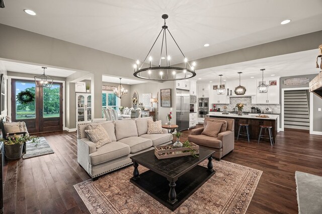 8275 Medlin Rd, Baxter, TN 38544 - living room featuring a chandelier, dark wood finished floors, recessed lighting, and stairway
