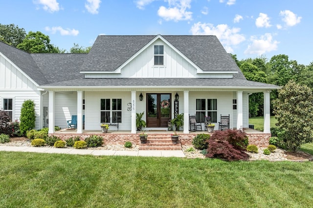 8275 Medlin Rd, Baxter, TN 38544 - modern inspired farmhouse featuring board and batten siding, covered porch, roof with shingles, a front yard, and french doors