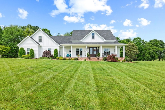 8275 Medlin Rd, Baxter, TN 38544 - modern farmhouse with board and batten siding, a front lawn, covered porch, and a shingled roof