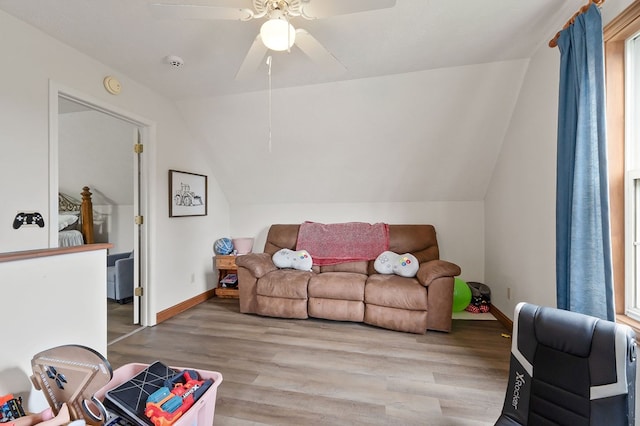 1841 SW Jones Chapel Rd, Byrdstown, TN 38549 - living room with vaulted ceiling, wood finished floors, ceiling fan, and baseboards