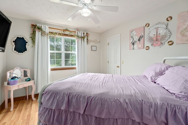 1841 SW Jones Chapel Rd, Byrdstown, TN 38549 - bedroom with light wood finished floors, ceiling fan, and baseboards