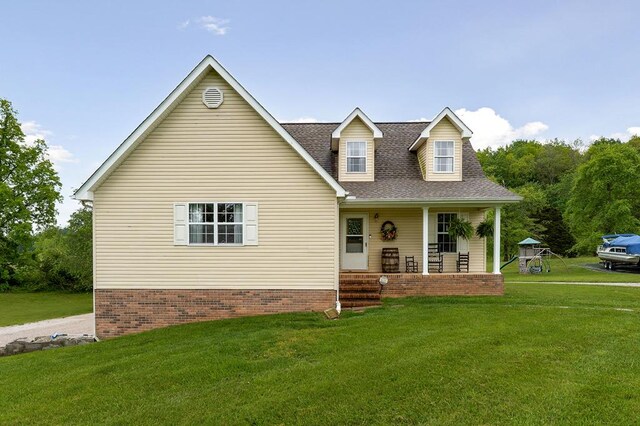 1841 SW Jones Chapel Rd, Byrdstown, TN 38549 - view of front of home with a front lawn, a porch, and a shingled roof