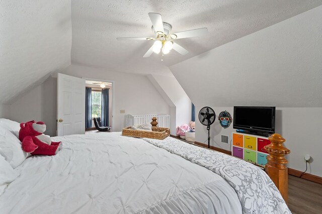 1841 SW Jones Chapel Rd, Byrdstown, TN 38549 - bedroom featuring vaulted ceiling, wood finished floors, a textured ceiling, a ceiling fan, and baseboards