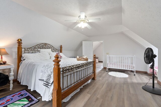 1841 SW Jones Chapel Rd, Byrdstown, TN 38549 - bedroom featuring wood finished floors, a textured ceiling, ceiling fan, vaulted ceiling, and baseboards
