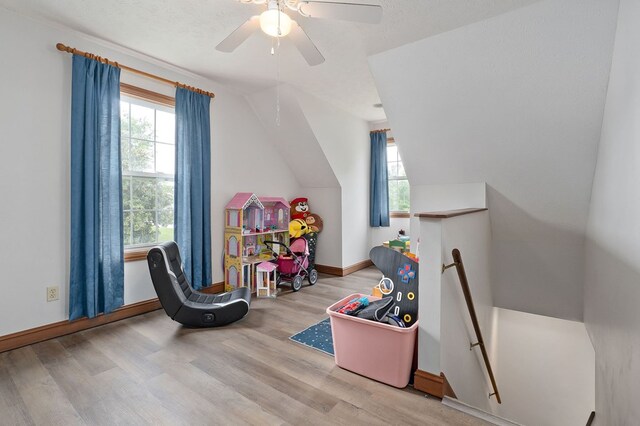 1841 SW Jones Chapel Rd, Byrdstown, TN 38549 - playroom with healthy amount of natural light, wood finished floors, baseboards, ceiling fan, and vaulted ceiling