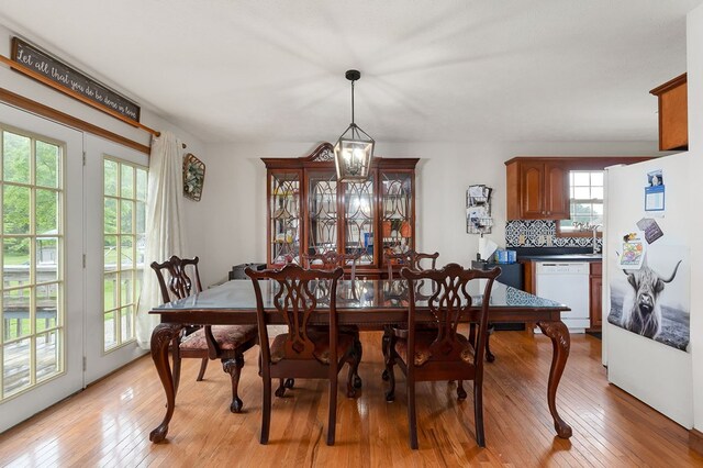 1841 SW Jones Chapel Rd, Byrdstown, TN 38549 - dining room with healthy amount of natural light, light wood-style flooring, and a chandelier