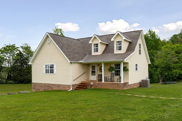 1841 SW Jones Chapel Rd, Byrdstown, TN 38549 - cape cod house with a porch, roof with shingles, a front yard, and central air condition unit