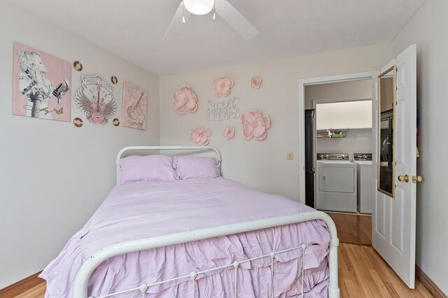 1841 SW Jones Chapel Rd, Byrdstown, TN 38549 - bedroom featuring washer and clothes dryer, light wood-style floors, and ceiling fan