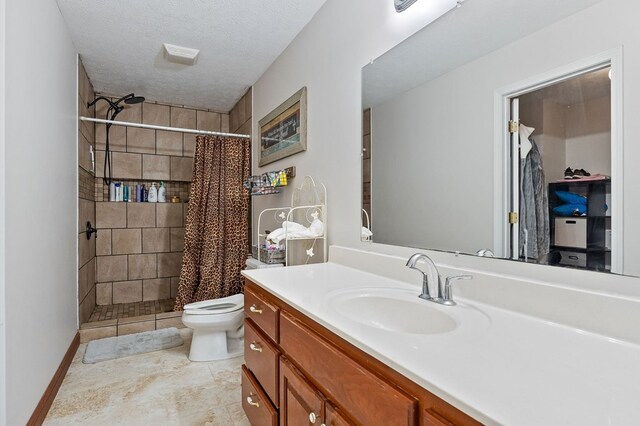 1841 SW Jones Chapel Rd, Byrdstown, TN 38549 - bathroom with a stall shower, toilet, vanity, and a textured ceiling
