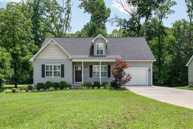 139 Rachelle Pl, Baxter, TN 38544 - cape cod home with a garage, driveway, roof with shingles, a front lawn, and covered porch