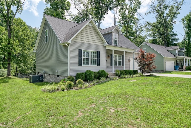 139 Rachelle Pl, Baxter, TN 38544 - view of front of house featuring a front yard, a garage, driveway, and roof with shingles