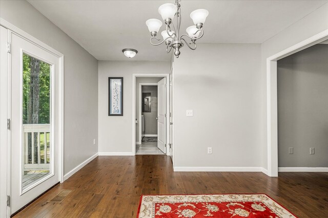 139 Rachelle Pl, Baxter, TN 38544 - unfurnished dining area featuring a chandelier and hardwood / wood-style floors