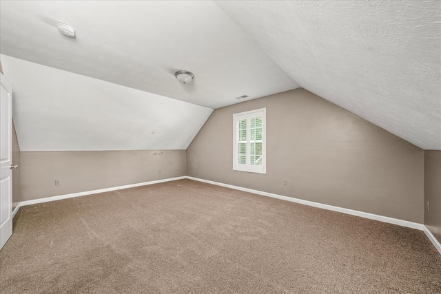 139 Rachelle Pl, Baxter, TN 38544 - additional living space featuring lofted ceiling, carpet, and a textured ceiling