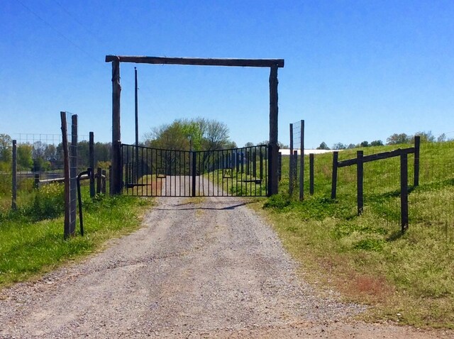 view of gate with fence