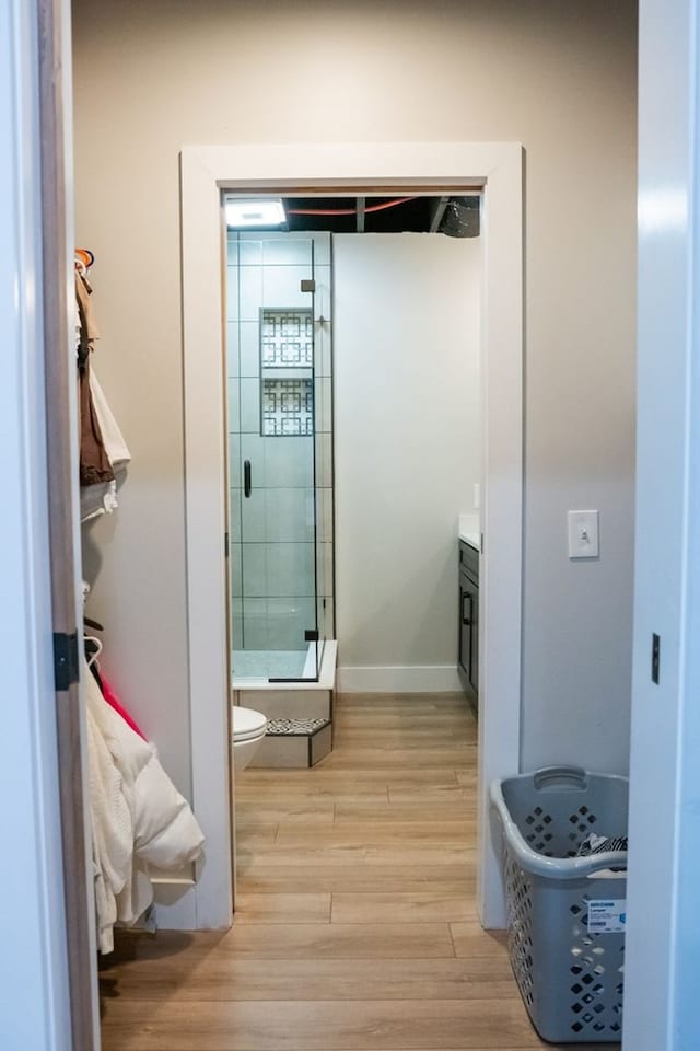 5414 Doubleview Cir, Baxter, TN 38544 - bathroom featuring a shower stall, wood finished floors, and vanity