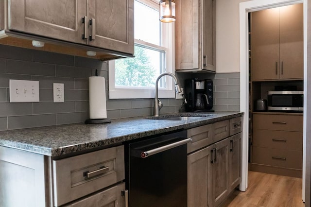 5414 Doubleview Cir, Baxter, TN 38544 - kitchen with dishwasher, stainless steel microwave, tasteful backsplash, and light wood-style flooring