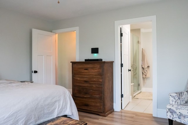 5414 Doubleview Cir, Baxter, TN 38544 - bedroom with light wood-type flooring and ensuite bathroom