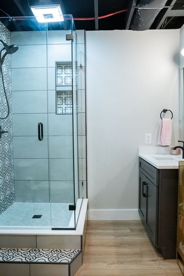 5414 Doubleview Cir, Baxter, TN 38544 - bathroom with wood finished floors, vanity, and a stall shower