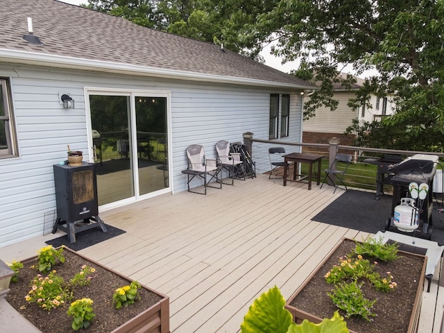 5414 Doubleview Cir, Baxter, TN 38544 - wooden terrace with a vegetable garden and area for grilling