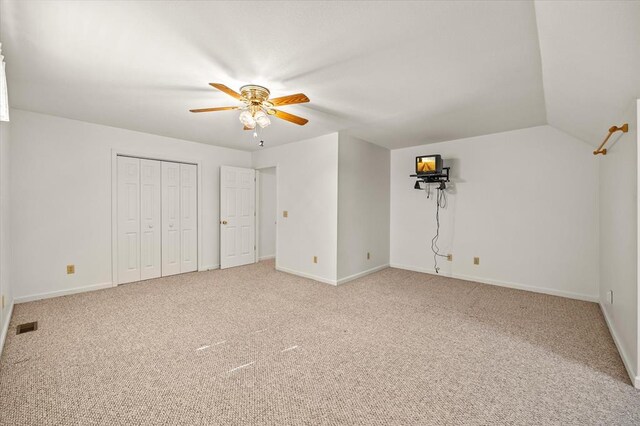 unfurnished bedroom featuring carpet, visible vents, and baseboards