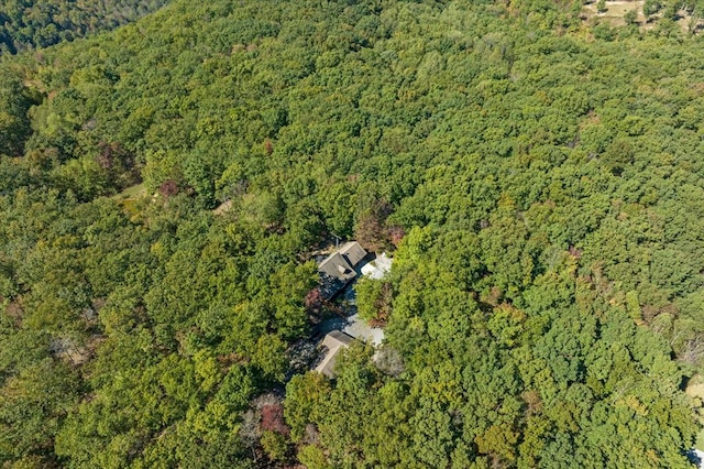 birds eye view of property featuring a view of trees