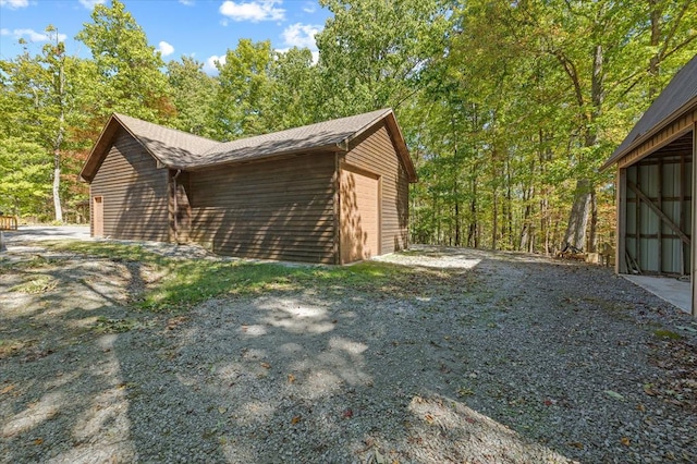 view of side of property featuring a garage