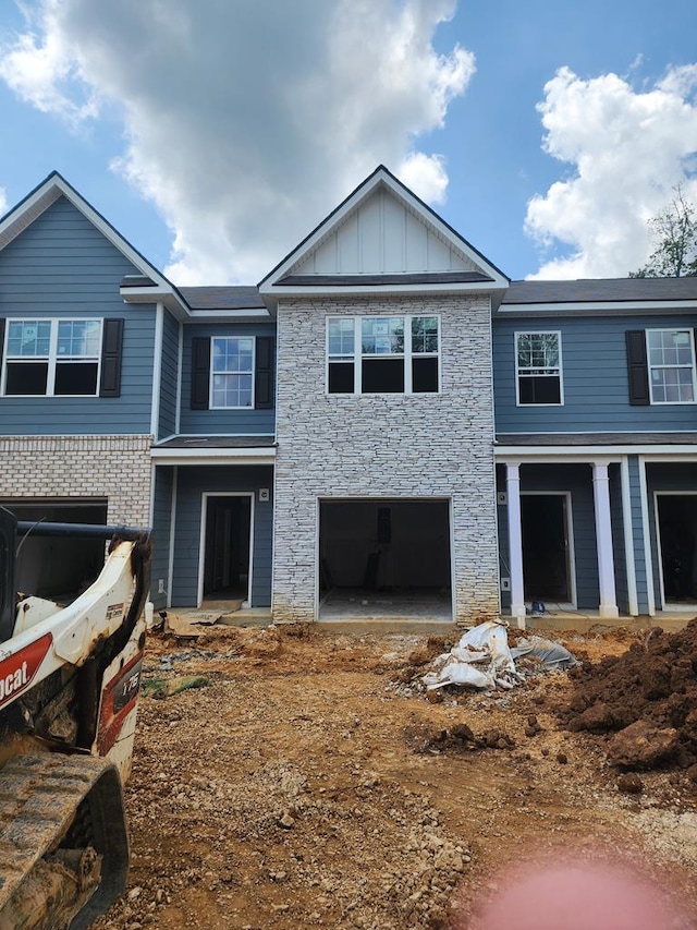 222 Dale Mires Ln, Baxter, TN 38544 - view of front of property with stone siding, a garage, and board and batten siding