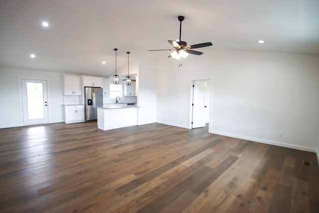 unfurnished living room featuring baseboards, dark wood finished floors, a ceiling fan, and recessed lighting