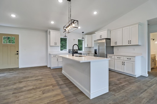819 Hack Beaty Rd, Grimsley, TN 38565 - kitchen featuring stainless steel refrigerator with ice dispenser, a center island with sink, white cabinetry, vaulted ceiling, and recessed lighting
