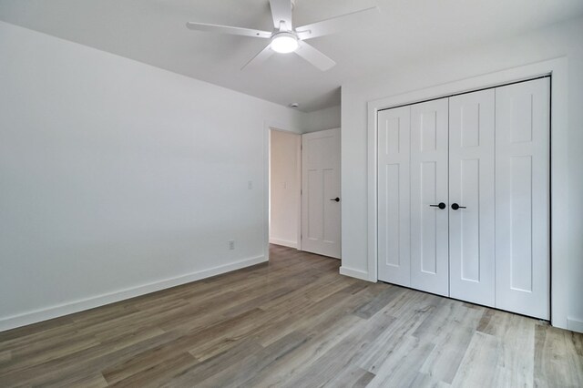 819 Hack Beaty Rd, Grimsley, TN 38565 - unfurnished bedroom featuring wood finished floors, a closet, and a ceiling fan