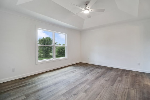 819 Hack Beaty Rd, Grimsley, TN 38565 - unfurnished room with a tray ceiling, wood finished floors, and ceiling fan