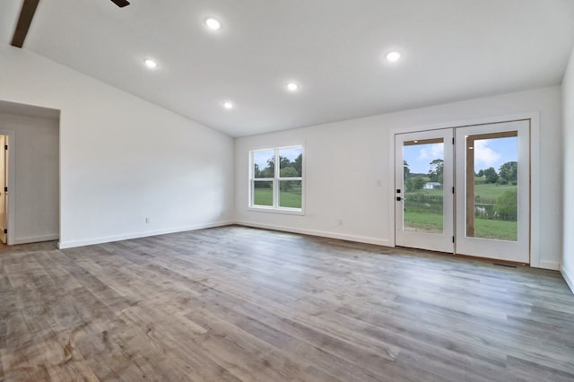 819 Hack Beaty Rd, Grimsley, TN 38565 - unfurnished room featuring vaulted ceiling, wood finished floors, recessed lighting, and a ceiling fan