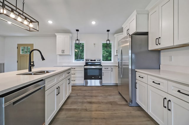 819 Hack Beaty Rd, Grimsley, TN 38565 - kitchen featuring appliances with stainless steel finishes, white cabinets, light countertops, hanging light fixtures, and recessed lighting