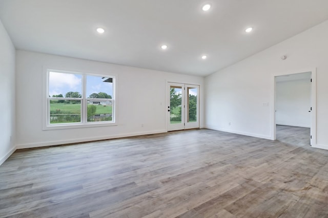 819 Hack Beaty Rd, Grimsley, TN 38565 - empty room with vaulted ceiling, recessed lighting, and wood finished floors
