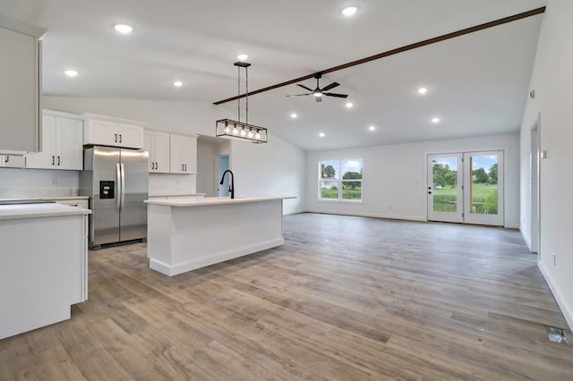 819 Hack Beaty Rd, Grimsley, TN 38565 - kitchen featuring stainless steel fridge with ice dispenser, lofted ceiling, ceiling fan, light countertops, and white cabinets