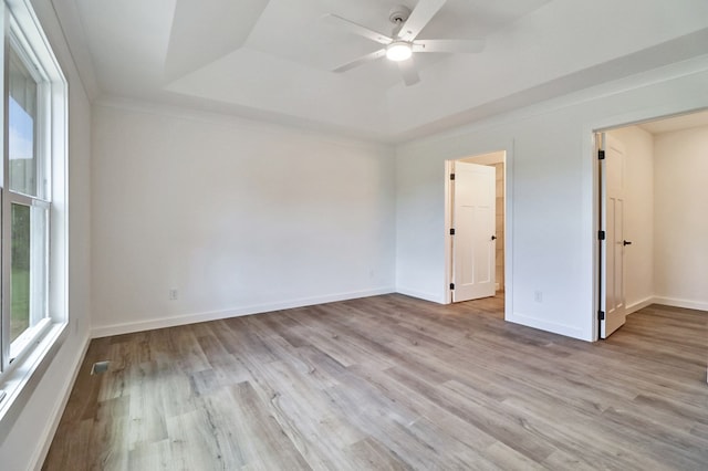819 Hack Beaty Rd, Grimsley, TN 38565 - empty room featuring plenty of natural light, a raised ceiling, a ceiling fan, and wood finished floors