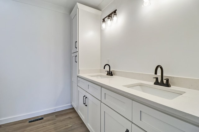 819 Hack Beaty Rd, Grimsley, TN 38565 - full bathroom with double vanity and wood finished floors