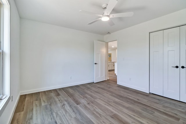 819 Hack Beaty Rd, Grimsley, TN 38565 - unfurnished bedroom with wood finished floors, a closet, and ceiling fan