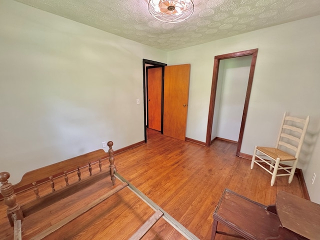 46326 US-127 S, Pikeville, TN 37367 - bedroom featuring a textured ceiling and wood finished floors