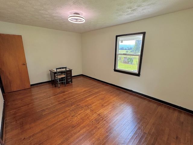 46326 US-127 S, Pikeville, TN 37367 - spare room featuring hardwood / wood-style floors and a textured ceiling