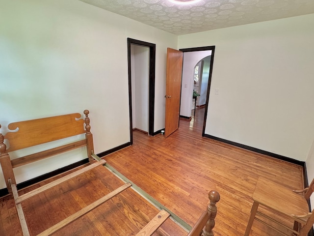 46326 US-127 S, Pikeville, TN 37367 - spare room with light wood-style flooring and arched walkways