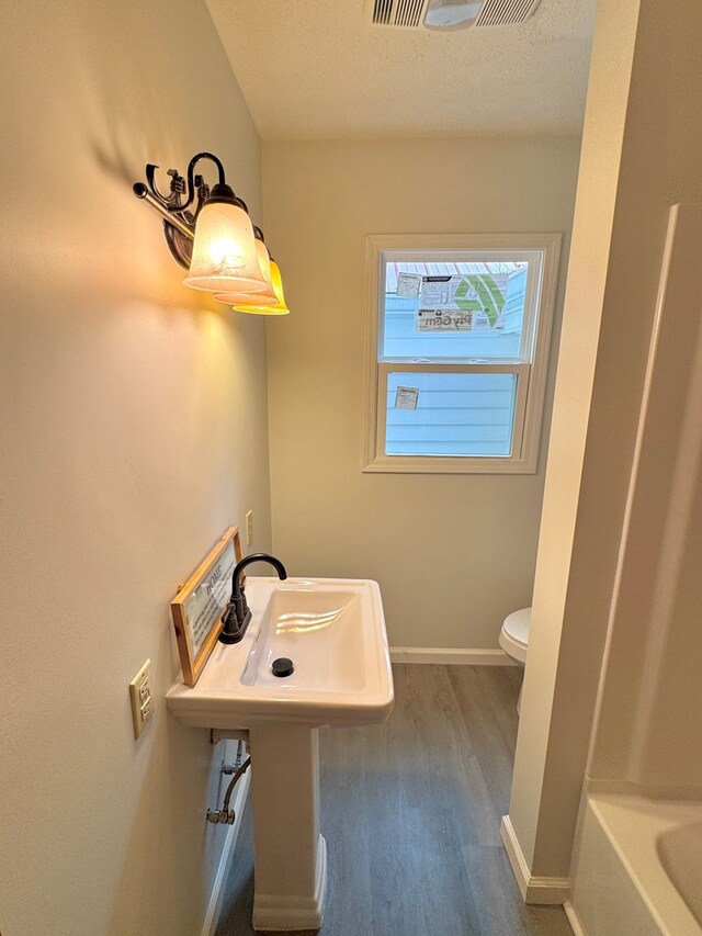 46326 US-127 S, Pikeville, TN 37367 - full bathroom featuring wood finished floors, a tub, a textured ceiling, and a shower