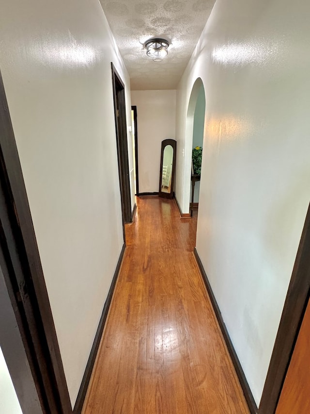 46326 US-127 S, Pikeville, TN 37367 - hall with arched walkways, a textured ceiling, and light wood finished floors