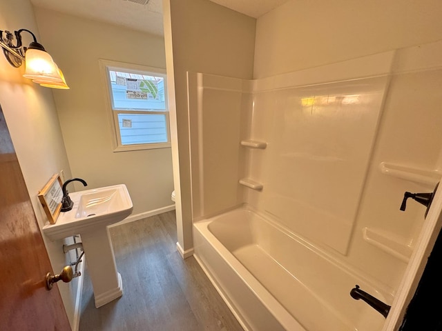 46326 US-127 S, Pikeville, TN 37367 - full bathroom with wood finished floors and shower / washtub combination