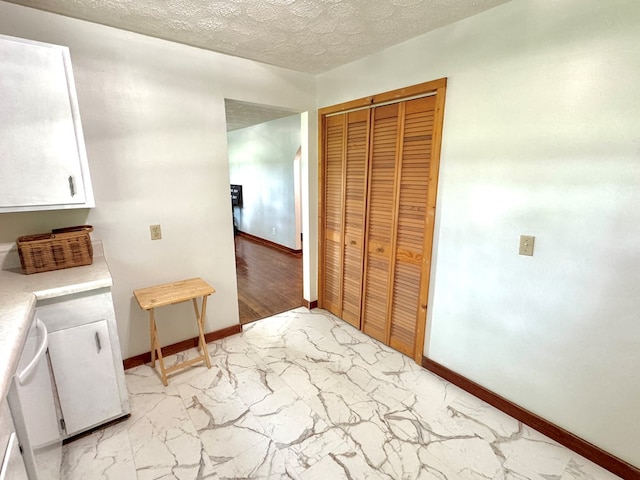 46326 US-127 S, Pikeville, TN 37367 - laundry area with light marble finish flooring and a textured ceiling