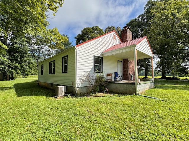 46326 US-127 S, Pikeville, TN 37367 - view of home's exterior with a yard, covered porch, and a chimney