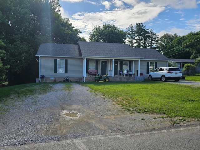 3073 Fisk Rd, Cookeville, TN 38506 - ranch-style house with covered porch, gravel driveway, and a front lawn