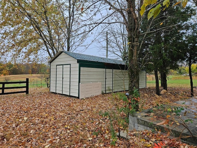 view of shed with fence