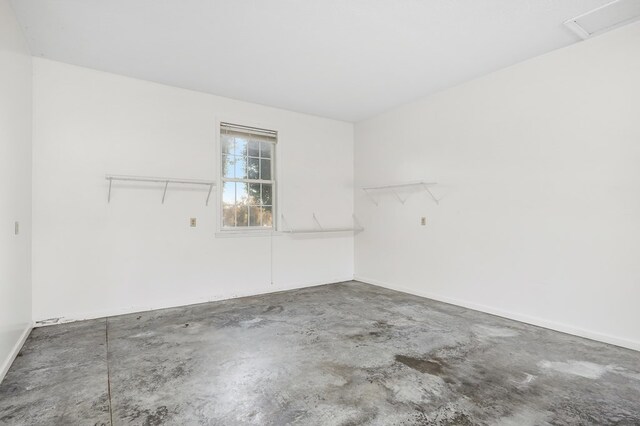 unfurnished room featuring concrete flooring