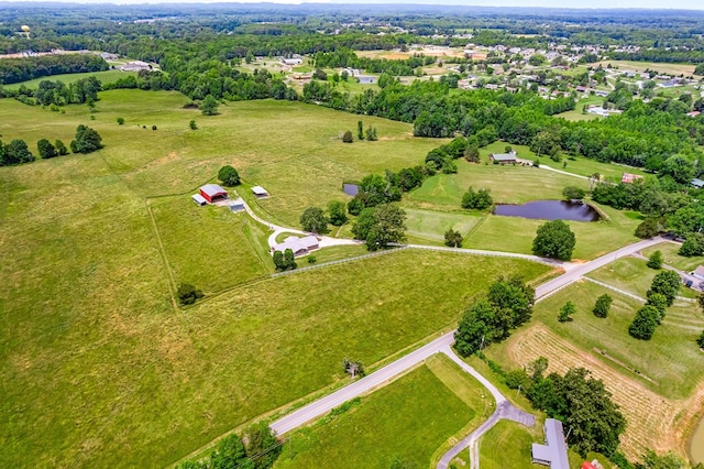 drone / aerial view featuring a rural view and a water view